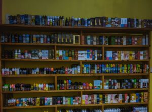 Vape juice wall display at smoke shop in Stuart FL—colorful e-liquid brands and flavors