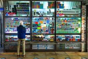 Vape shop Stuart FL—bright storefront with accessories, customer browsing products and services.